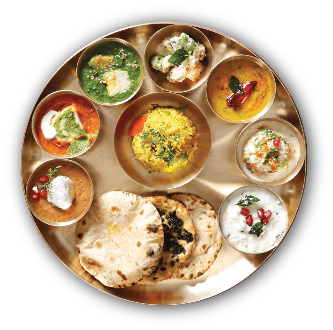 Fobox thali — dal, sabzi, rice, roti, curry and raita in a brass plate